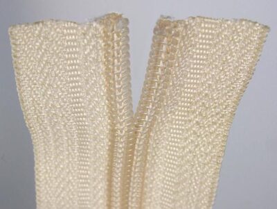 Cut-off end of a spiral zip fastener