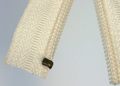 Pressing top stop using Osborne pliers – top side