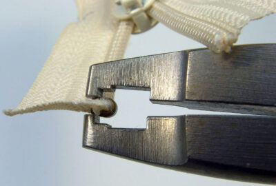 Pressing top stop using Osborne pliers