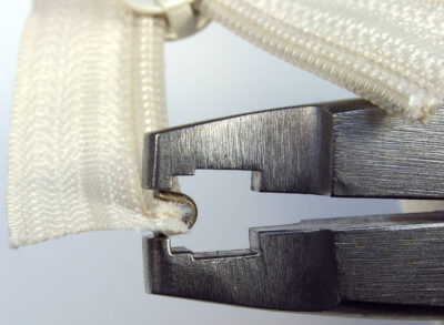 Positioning top stop using Osborne pliers