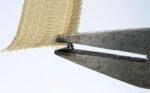 Pressing the top stop with flat pliers