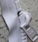 Delrin 9 slider in front of the alternative stainless steel top stop made by YKK